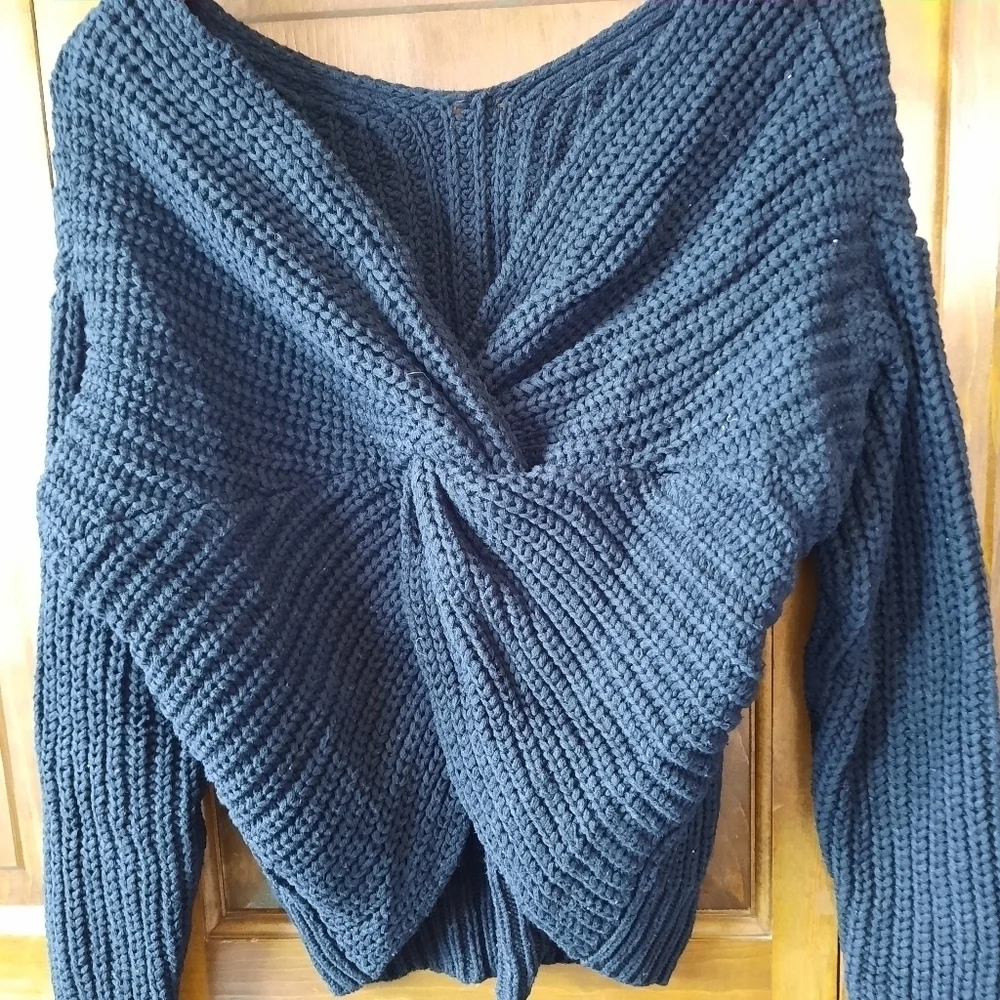 Black chunky ribbed knit crewneck sweater with back v-neck twist knot